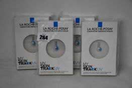 Four boxed as new La Roche-Posay My Skin Track UV wearable sensors.