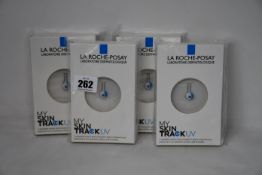 Four boxed as new La Roche-Posay My Skin Track UV wearable sensors.