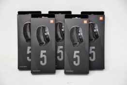 Five boxed as new Xiaomi Mi Smart Band 5 Fitness Trackers in black.