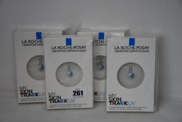 Four boxed as new La Roche-Posay My Skin Track UV wearable sensors.