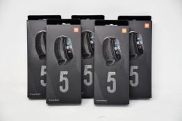 Five boxed as new Xiaomi Mi Smart Band 5 Fitness Trackers in black.