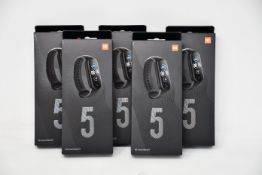 Five boxed as new Xiaomi Mi Smart Band 5 Fitness Trackers in black.