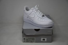 A pair of as new Nike Air Force 1 07 trainers (UK 6).
