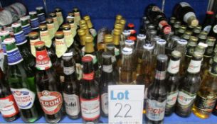 A shelf of assorted beers\ciders\ales to include Budweiser, Corona Extra, San Miguel and Birra