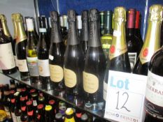 A shelf of assorted wines and champagnes to include Codorniu, Valserrano, Baron de Ley and Val del