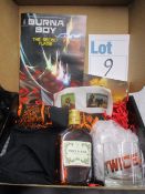 Six Burna Boy promo boxes to include comics, glasses, stickers, t-shirts and Hennessy (Over 18s