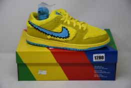 A pair of boxed as new Nike SB Dunk Low 