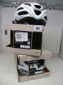 Two boxed as new Giro adult cycling helmets, matt white.