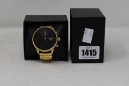 A men's boxed as new Talley and Twine Black and Gold metal band watch.