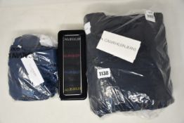 An as new Calvin Klein Moto quilted jacket (S), Calvin Klein golf top (M) and a Calvin Klein tin