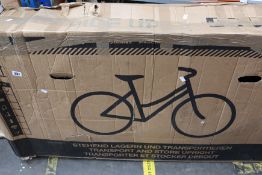 A boxed Marin Bobcat trail 3 mountain bike in gloss black with medium sized frame.