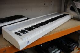A pre-owned Korgs B1 digital piano keyboard (Missing power cable).