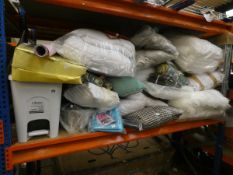 A quantity of bedding, cushions, towels and household and related items (One shelf).