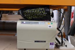 An Ideal 8343 paper folder and Business line wire binder.