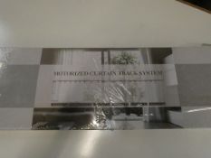 A boxed as new Motorized Curtain Track System.