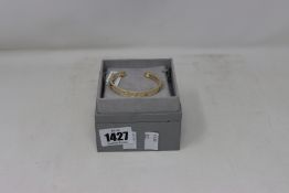 A boxed as new Michael Kors 14K Gold Plated Nest Heart Pavé Crystal Cuff Bracelet.