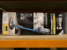 A boxed Shark corded stick vacuum cleaner with anti hair wrap.