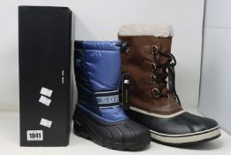 A pair of as new Sorel 1964 Pac boots (UK 10.5) and children's Sorel Youth Cub boots (UK 1).