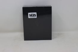 An as new sealed Paul Valentine steel mesh strap black face watch.