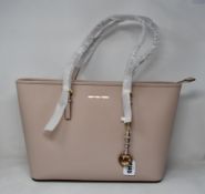 An as new Michael Kors Jet Set Travel tote bag.