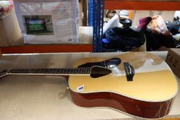 A pre-owned Gretsch acoustic guitar (Model number G-5034 nat) with carry case.