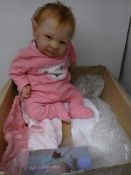 An Ava by Cassie Brace reborn doll.
