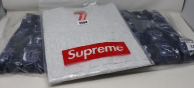 An as new Supreme Blocks hooded sweatshirt (M) together with a Supreme Cutout Logo T-shirt (M).