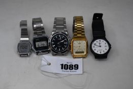 Five Casio wrist watches.