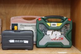 A Triton pocket hole 675 piece screw kit, a Bosch X70ti 70 piece mixed drill bit set and a Facom