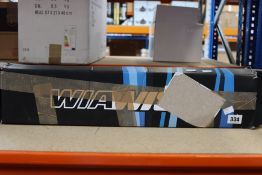 A boxed Win & Win Wiawis ATF-X Recurve Riser 25 LH in neon pink.