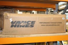 A boxed as new Vance & Hines exhaust (Model unknown).
