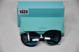 A pair of boxed as new Tiffany & Co black blue gradient sunglasses.