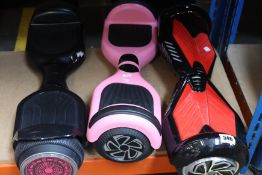 Three pre-owned hoverboards to include a VOYAGER HOVER-4040HB-PNK and a two-wheeled HY-A02 (Bags and