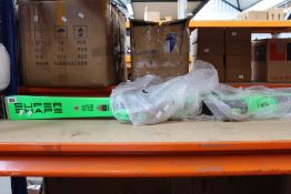 A pair of Head Supershape I.Magnum Skis R14.2 L177 in green and grey.