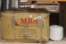 Eighteen spools of MBA Yarns 100% wool ecru yarn.
