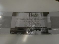 A boxed as new Motorized Curtain Track System.