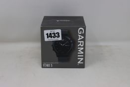 An as new sealed Garmin Fenix 5 Sapphire Edition premium multi-sport GPS watch black with black