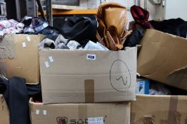 A quantity of assorted as new clothing and related items.