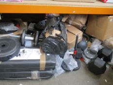 A large quantity of assorted weights and kettle bells, various sizes and weights.