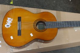 A Yamaha C40 classical guitar (Some slight damage).