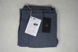 A pair of as new Dunhill London jeans (32R).