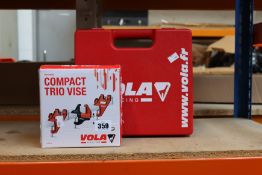 A Vola Racing waxing kit to include race wax, a waxing iron plus more and a Vola Racing compact trio
