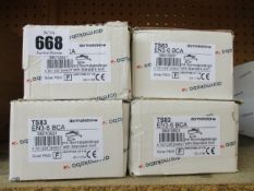 Four boxed Dormakaba TS83 Size 3-6 overhead door closers.