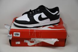 A pair of as new Nike Dunk Low Retro white/black 2021 (UK 11 - distressed box).