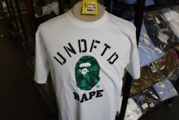 An as new A Bathing Ape Undefeated College T-shirt (L).