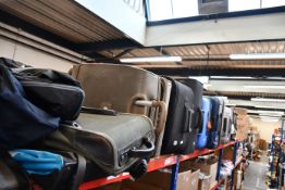 A quantity of empty suitcases/holdalls.