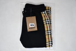 A pair of as new Burberry joggers (S).