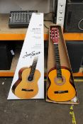 An as new Mad About Child guitar and a Jose Ferrer classic guitar.