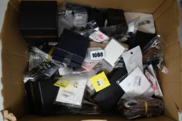A box of assorted jewellery to include watches and earrings.