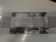 A boxed as new Motorized Curtain Track System.